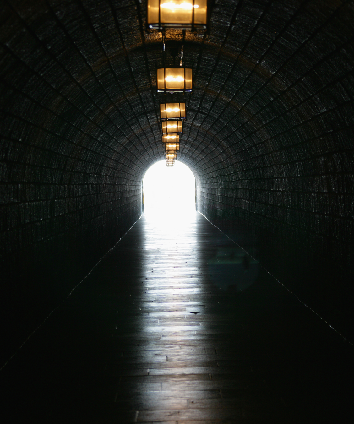 Illuminated tunnel representing a spiritual journey and inner growth at Calea ta spirituala.