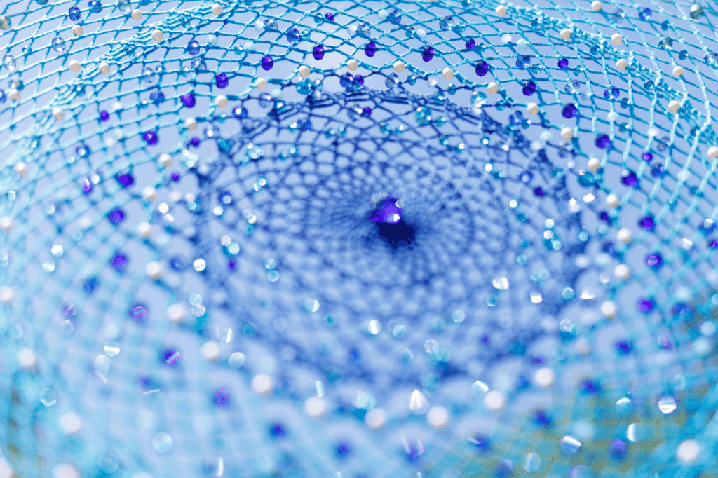 Blue spiritual bead net with purple accents, symbolizing inner peace and spiritual enlightenment.