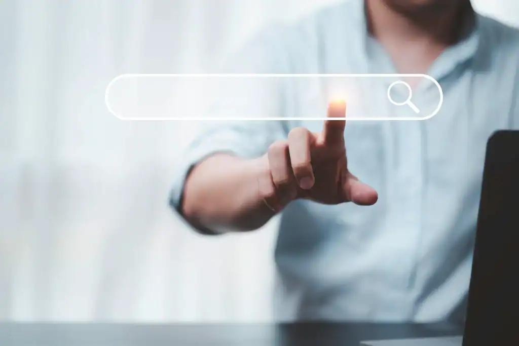 Search bar with a person touching a virtual search icon, symbolizing spiritual journey and self-disc.