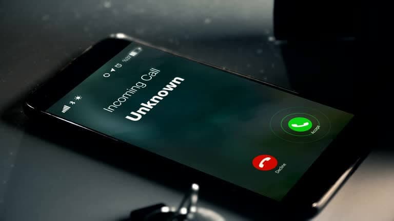 Incoming call from an unknown number on a smartphone.